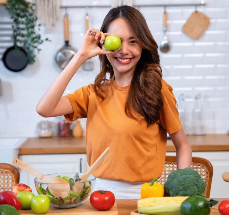 beautiful-young-woman-happy-portrait-cooking-fresh-organic-clean-food-fruit-at-home-modern-kitchen-3.jpg
