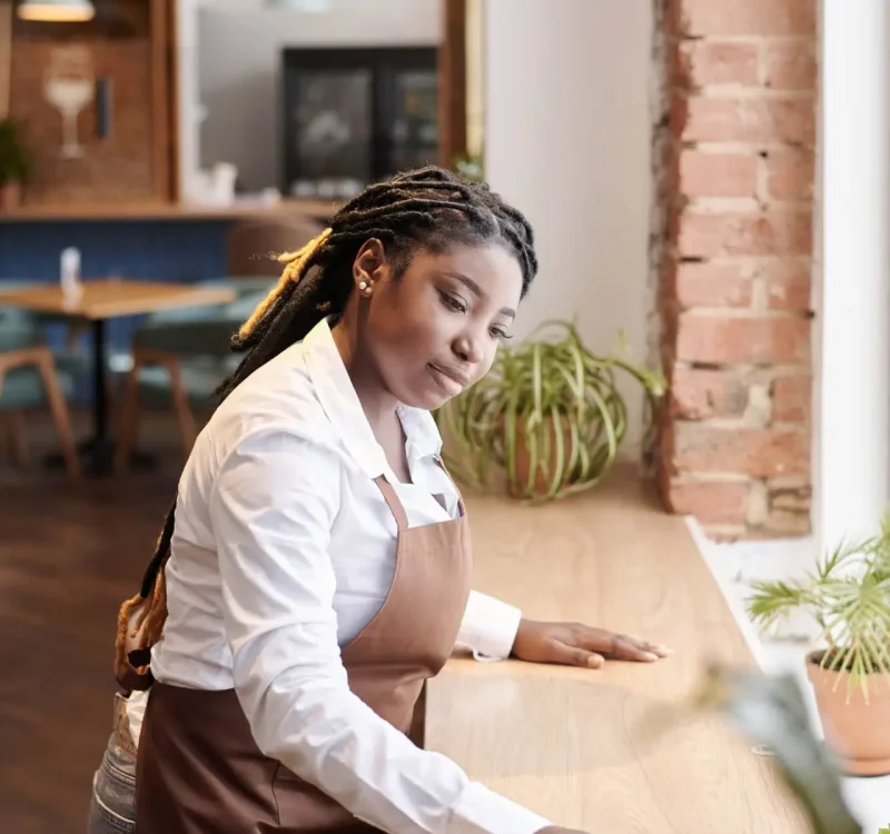 young-black-waitress-cleaning-table.jpg